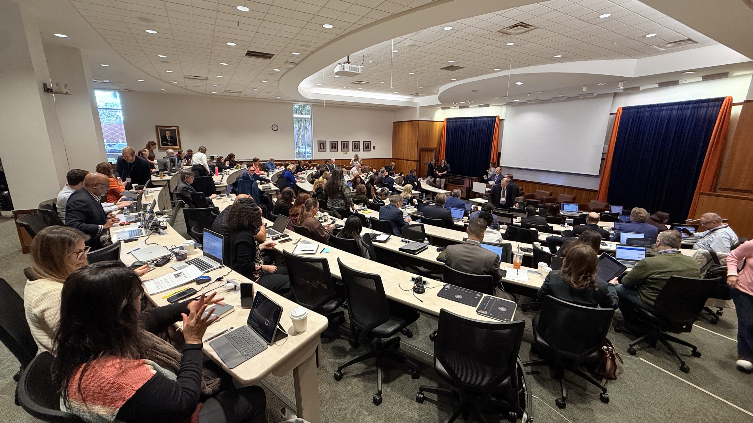 Two attendees talk outside between sessions at the 2026 UF Law E-Discovery Conference.
